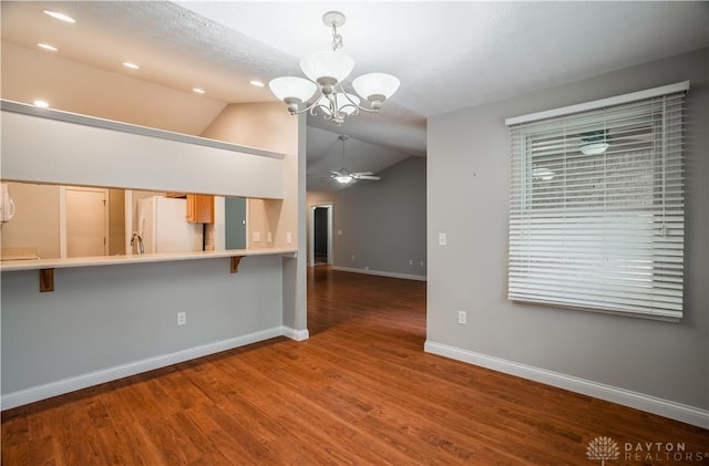797 Waldsmith Way, Vandalia, OH 45377 - unfurnished living room featuring a ceiling fan, vaulted ceiling, a chandelier, wood finished floors, and recessed lighting