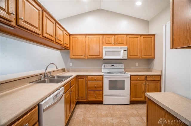 797 Waldsmith Way, Vandalia, OH 45377 - kitchen with white appliances, vaulted ceiling, light countertops, light tile patterned floors, and brown cabinetry