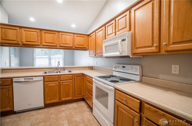 797 Waldsmith Way, Vandalia, OH 45377 - kitchen featuring white appliances, brown cabinetry, light countertops, lofted ceiling, and recessed lighting