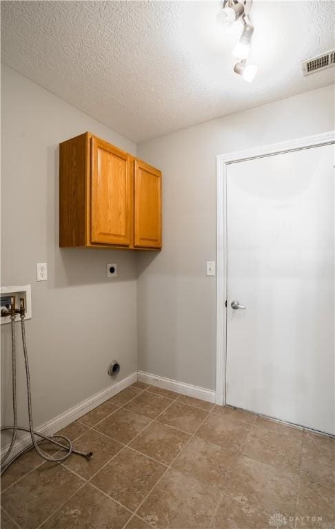 797 Waldsmith Way, Vandalia, OH 45377 - laundry room with cabinet space, hookup for a washing machine, hookup for an electric dryer, and a textured ceiling