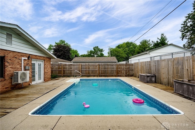 5587 Penn Ave, Riverside, OH 45432 - view of pool featuring french doors, a fenced backyard, and a wooden deck