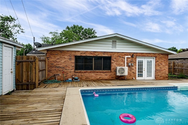 5587 Penn Ave, Riverside, OH 45432 - rear view of house with french doors, a wooden deck, and brick siding