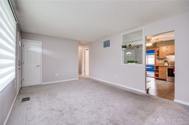 5587 Penn Ave, Riverside, OH 45432 - spare room with carpet, ceiling fan, and a textured ceiling