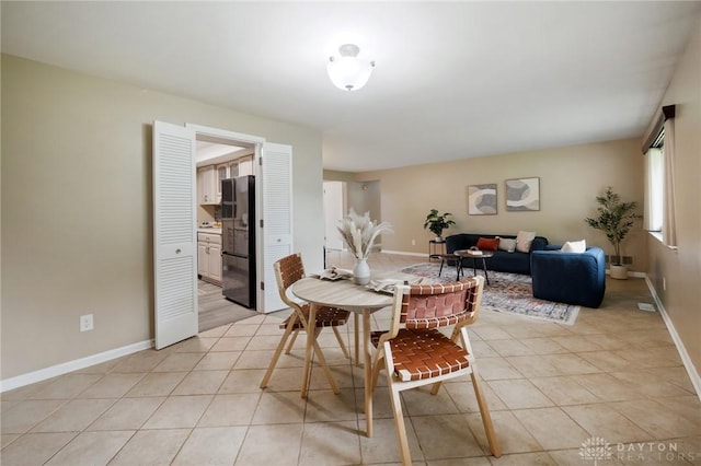 521 Park Ridge Dr, Centerville, OH 45459 - dining area with baseboards and light tile patterned floors