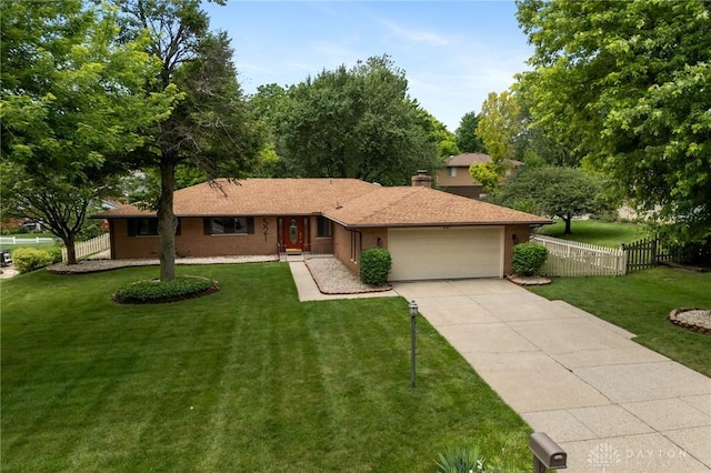 521 Park Ridge Dr, Centerville, OH 45459 - ranch-style home featuring an attached garage, concrete driveway, and a chimney
