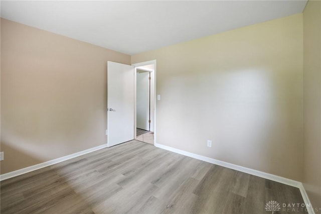 521 Park Ridge Dr, Centerville, OH 45459 - spare room featuring wood finished floors and baseboards