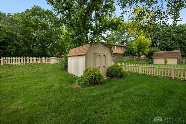521 Park Ridge Dr, Centerville, OH 45459 - fenced backyard featuring a storage unit and view of wooded area