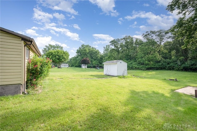 824 Euclid St, Bellefontaine, OH 43311 - view of grassy yard featuring a storage unit