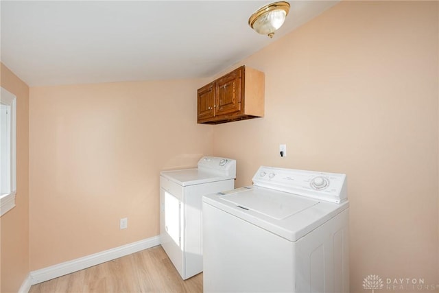 824 Euclid St, Bellefontaine, OH 43311 - laundry room with separate washer and dryer, cabinet space, and light wood-type flooring