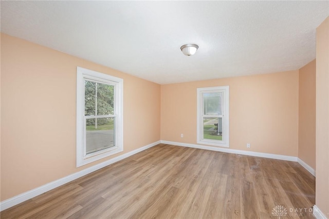 824 Euclid St, Bellefontaine, OH 43311 - empty room with light wood finished floors and baseboards