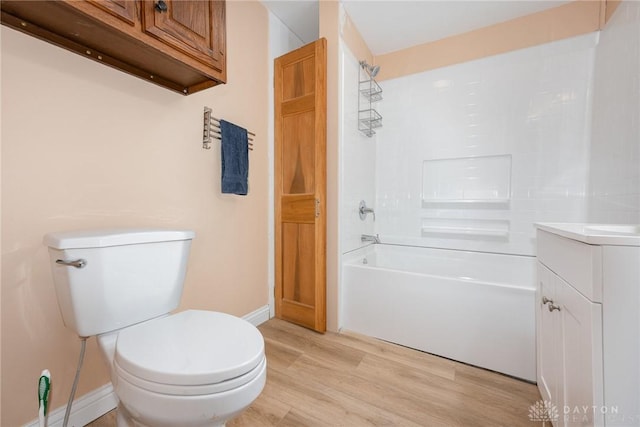 824 Euclid St, Bellefontaine, OH 43311 - full bathroom with bathing tub / shower combination, wood finished floors, and vanity