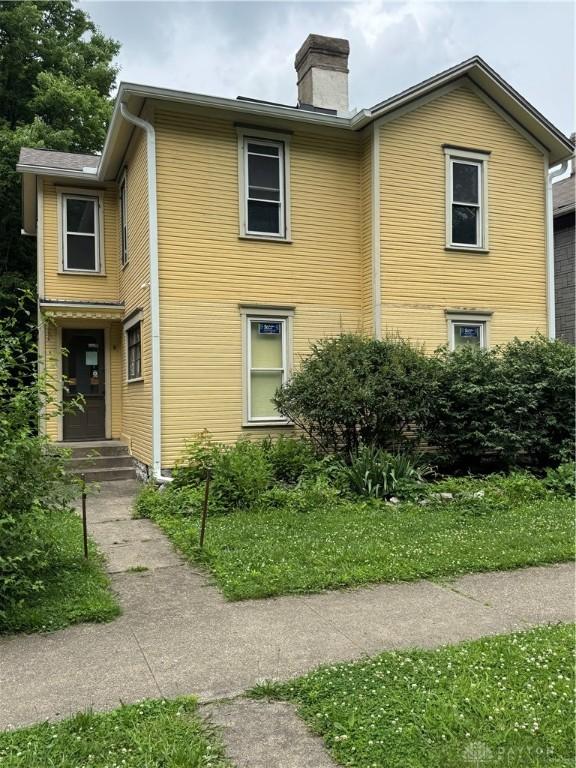 527 Wyoming St Unit 525, Dayton, OH 45410 - view of home's exterior with a chimney