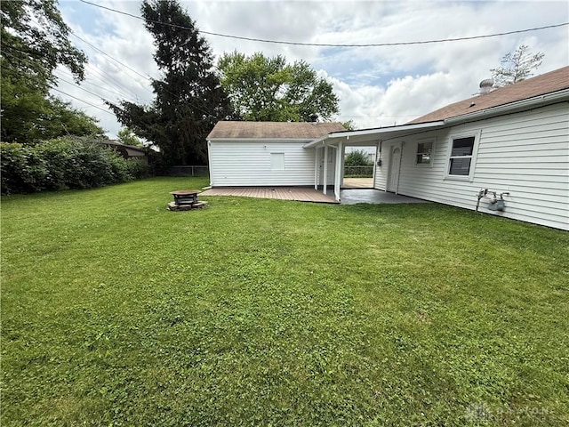 874 Bristol Dr, Vandalia, OH 45377 - view of yard with a wooden deck and an outdoor fire pit