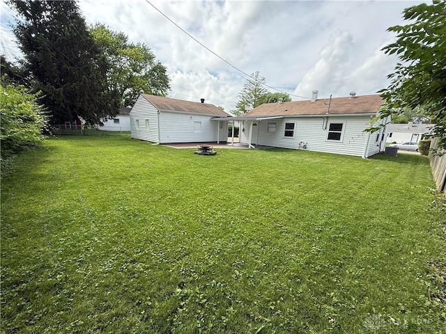874 Bristol Dr, Vandalia, OH 45377 - back of property featuring a patio area and a fire pit