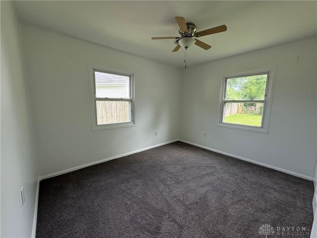 874 Bristol Dr, Vandalia, OH 45377 - empty room with dark colored carpet and ceiling fan