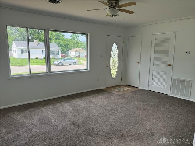874 Bristol Dr, Vandalia, OH 45377 - entrance foyer featuring plenty of natural light, carpet flooring, ceiling fan, and ornamental molding