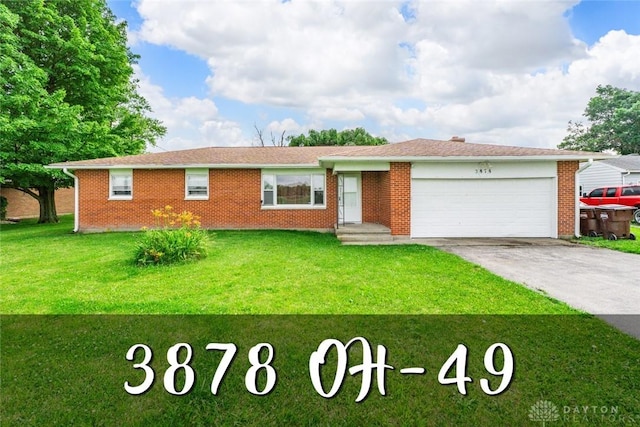 3878 State Route 49, Arcanum, OH 45304 - ranch-style house featuring an attached garage, concrete driveway, a front lawn, and brick siding