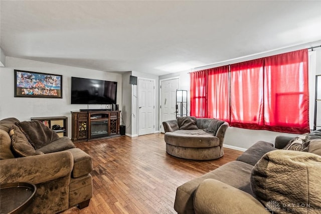 3878 State Route 49, Arcanum, OH 45304 - living room with hardwood / wood-style flooring and a fireplace