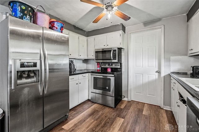 3878 State Route 49, Arcanum, OH 45304 - kitchen featuring appliances with stainless steel finishes, dark wood finished floors, ceiling fan, white cabinetry, and dark countertops