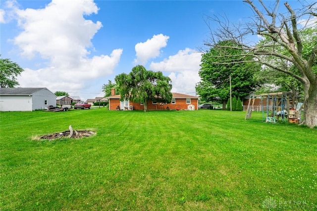 3878 State Route 49, Arcanum, OH 45304 - view of grassy yard with a fire pit