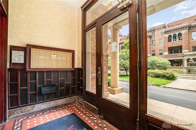 2356 Park Ave Unit 9, Cincinnati, OH 45206 - doorway to outside featuring carpet flooring and wainscoting