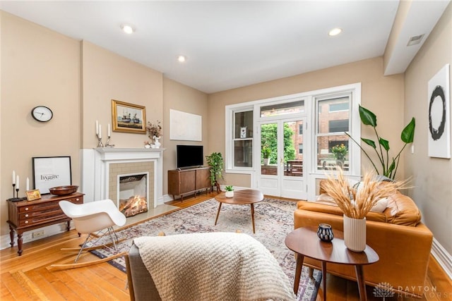 2356 Park Ave Unit 9, Cincinnati, OH 45206 - living area with light wood finished floors, a fireplace with flush hearth, and recessed lighting