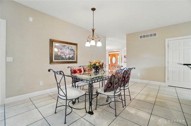 655 Devanshae Ct, Hamilton, OH 45013 - dining room with light tile patterned floors and a chandelier