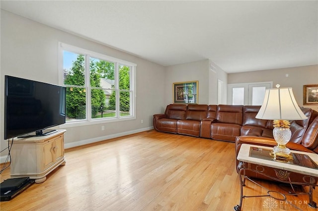 655 Devanshae Ct, Hamilton, OH 45013 - living area featuring light wood-type flooring and healthy amount of natural light