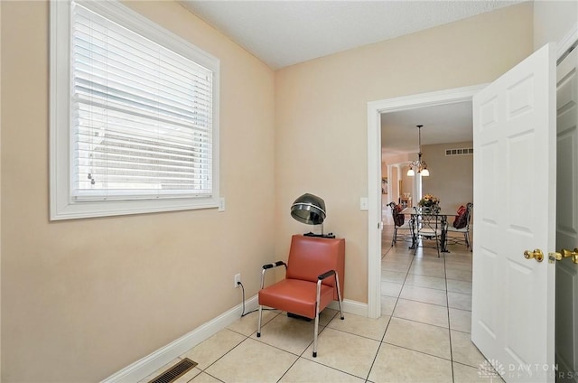 655 Devanshae Ct, Hamilton, OH 45013 - sitting room featuring light tile patterned floors and a chandelier