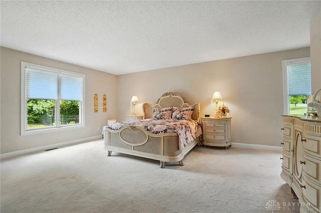 655 Devanshae Ct, Hamilton, OH 45013 - bedroom featuring light carpet and a textured ceiling