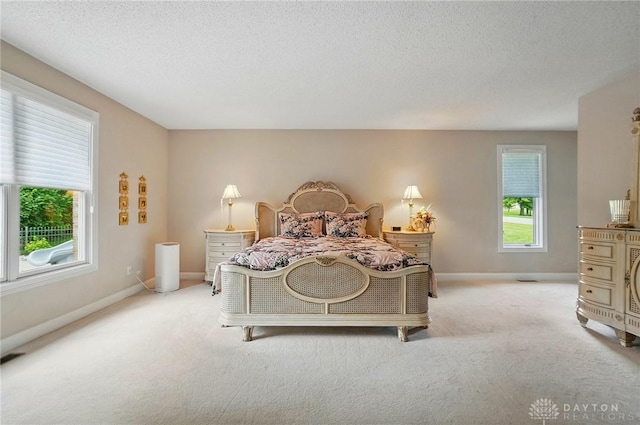 655 Devanshae Ct, Hamilton, OH 45013 - carpeted bedroom with a textured ceiling