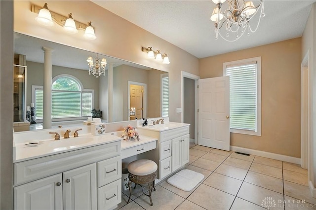 655 Devanshae Ct, Hamilton, OH 45013 - full bath featuring a chandelier, double vanity, and tile patterned floors