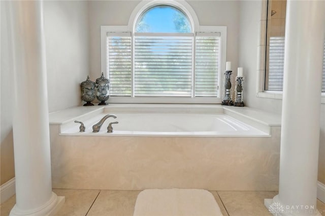 655 Devanshae Ct, Hamilton, OH 45013 - bathroom featuring ornate columns, a bath, and tile patterned floors