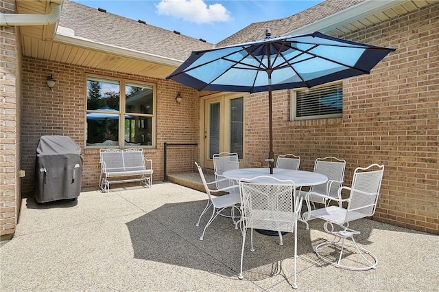 655 Devanshae Ct, Hamilton, OH 45013 - view of patio featuring a grill and outdoor dining area
