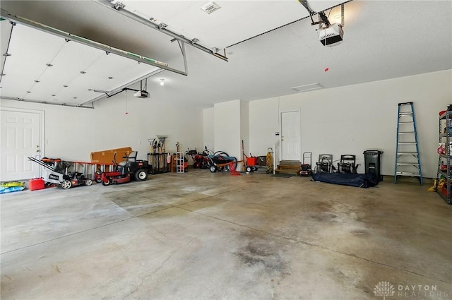655 Devanshae Ct, Hamilton, OH 45013 - garage featuring a garage door opener