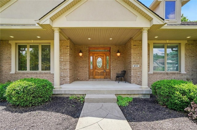 655 Devanshae Ct, Hamilton, OH 45013 - view of exterior entry featuring brick siding and a porch