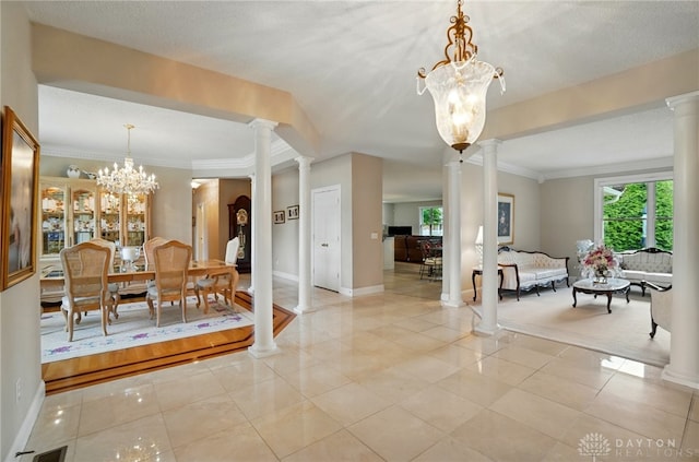 655 Devanshae Ct, Hamilton, OH 45013 - dining area with decorative columns, a chandelier, and crown molding