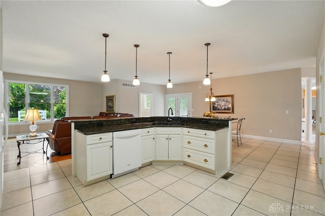 655 Devanshae Ct, Hamilton, OH 45013 - kitchen featuring dishwasher, open floor plan, light tile patterned flooring, and white cabinetry