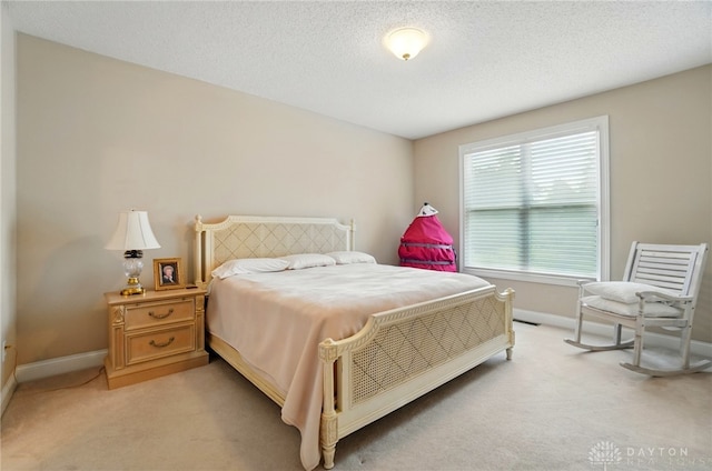 655 Devanshae Ct, Hamilton, OH 45013 - bedroom featuring light colored carpet and a textured ceiling
