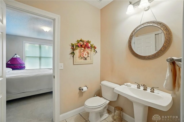 655 Devanshae Ct, Hamilton, OH 45013 - ensuite bathroom with toilet and tile patterned floors