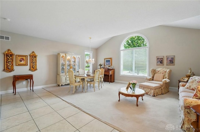 655 Devanshae Ct, Hamilton, OH 45013 - dining room with a chandelier, lofted ceiling, light colored carpet, and light tile patterned floors