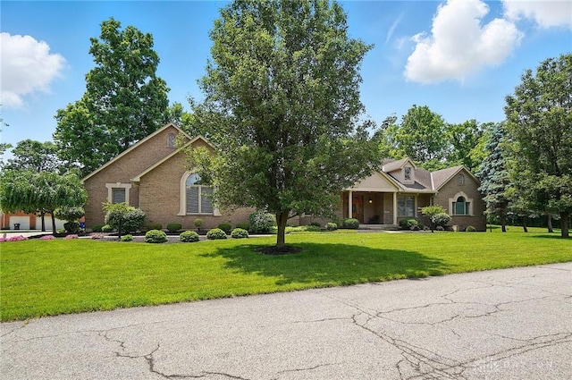 655 Devanshae Ct, Hamilton, OH 45013 - view of front facade featuring a front lawn and brick siding