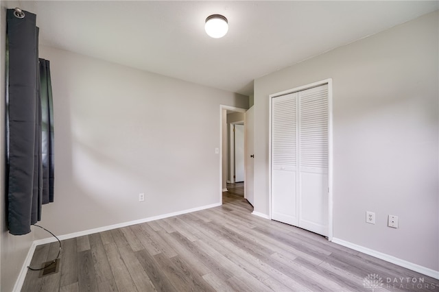 1919 Atkinson Dr, Xenia, OH 45385 - unfurnished bedroom featuring wood finished floors and a closet