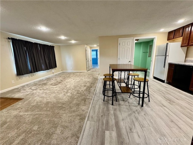 3626 Merwin 10 Mile Rd, Oh, OH 45245 - dining area featuring a textured ceiling, recessed lighting, light wood finished floors, and light colored carpet