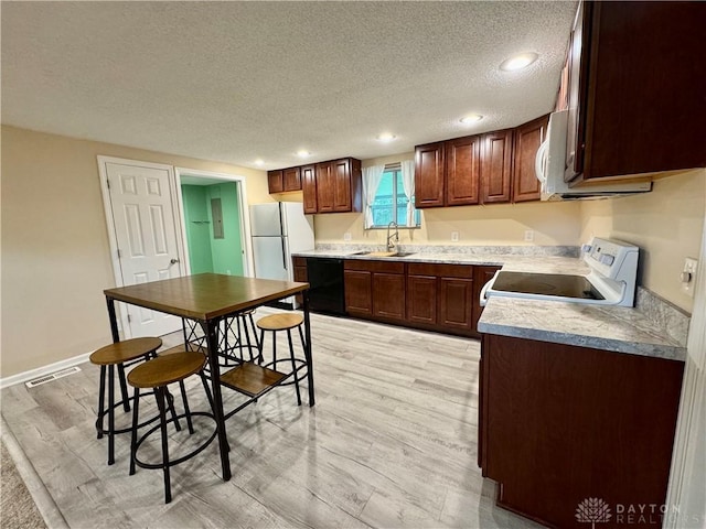 3626 Merwin 10 Mile Rd, Oh, OH 45245 - kitchen with dishwasher, electric range oven, freestanding refrigerator, a textured ceiling, and light wood-style flooring