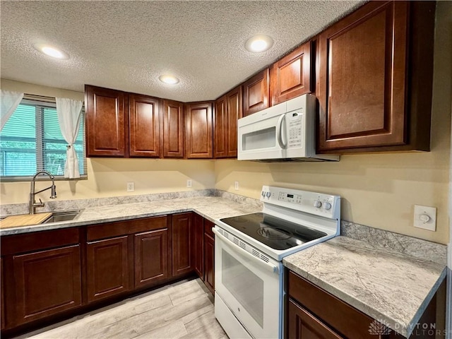 3626 Merwin 10 Mile Rd, Oh, OH 45245 - kitchen featuring white appliances, light countertops, light wood-style flooring, a textured ceiling, and recessed lighting