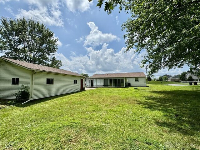 3626 Merwin 10 Mile Rd, Oh, OH 45245 - back of house with a yard and a sunroom