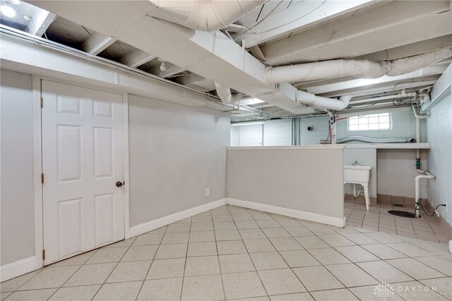 1603 Rosemont Blvd, Dayton, OH 45410 - basement featuring light tile patterned flooring and baseboards