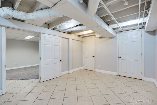 1603 Rosemont Blvd, Dayton, OH 45410 - finished basement featuring light tile patterned floors and baseboards