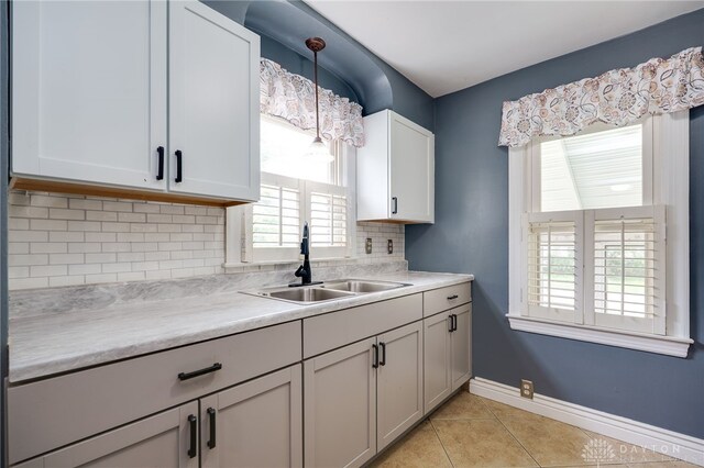 1603 Rosemont Blvd, Dayton, OH 45410 - kitchen with light countertops, plenty of natural light, and light tile patterned floors